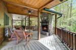 Outdoor wood burning fireplace on the main floor porch